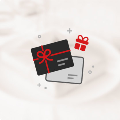 Two gift cards with a small red gift box icon on a blurred background.